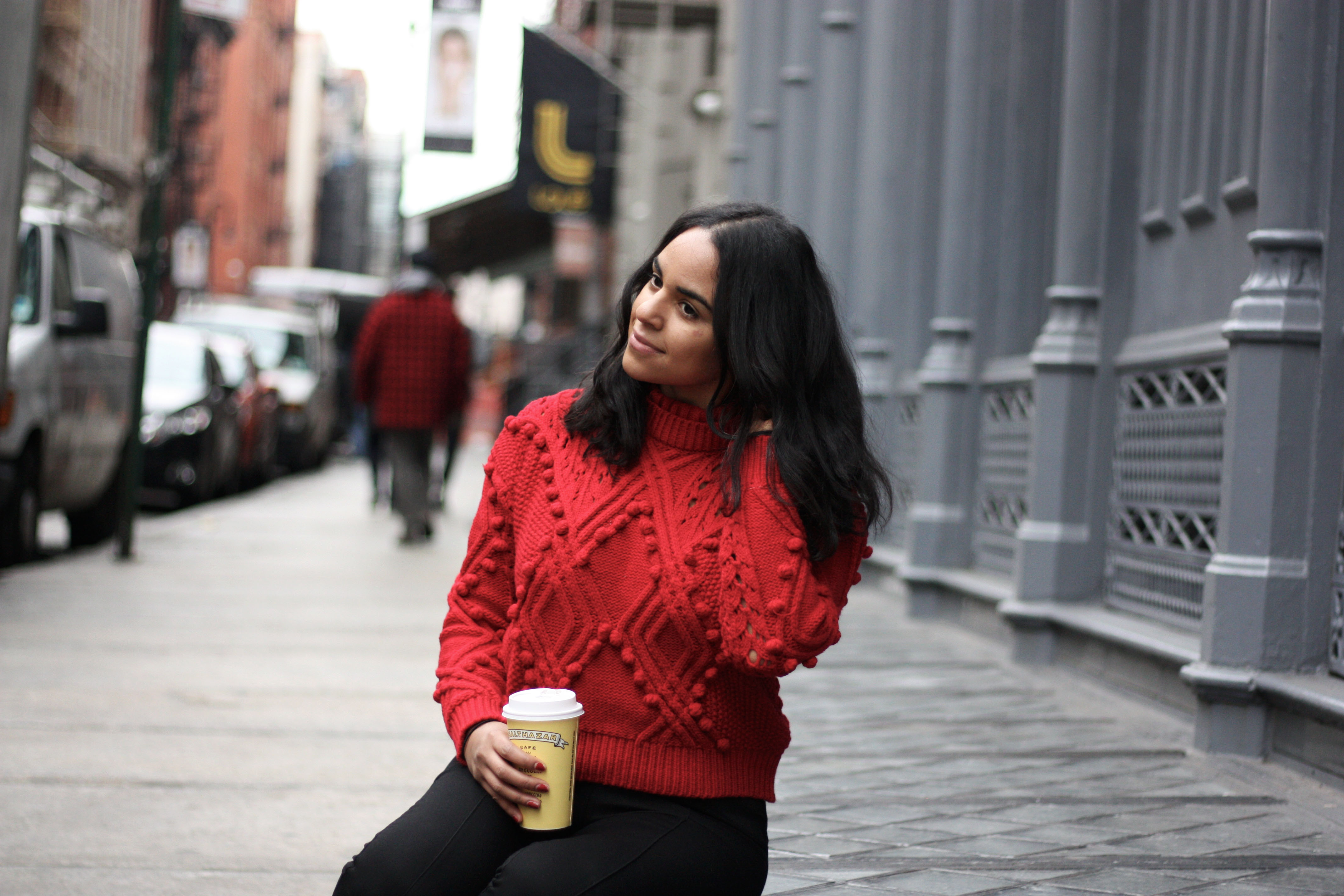 wearing a cropped red sweater in nyc